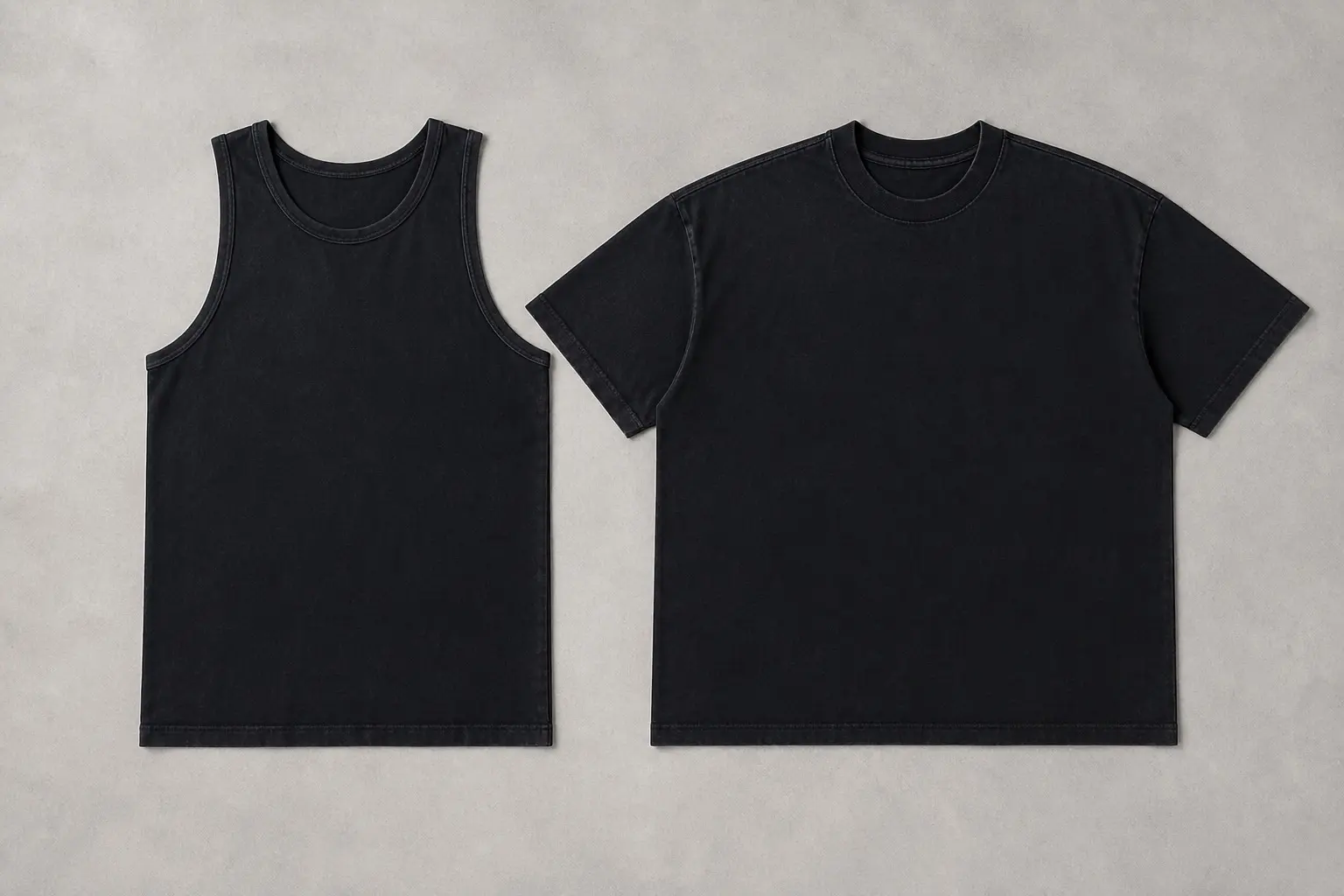 A black sleeveless tank and a black short-sleeve tee laid flat side by side, squared at the collar, showing the difference in shoulder and armhole