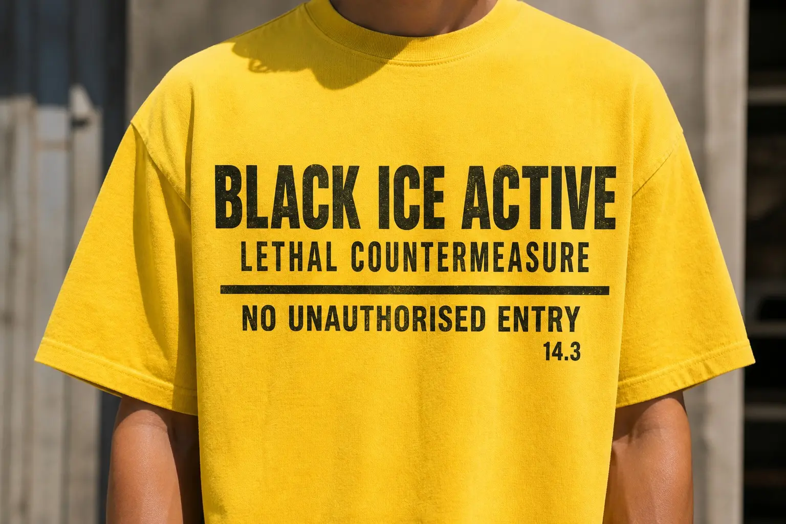 A safety-yellow tee printed in black only as an industrial hazard placard, three stacked bands of type — BLACK ICE ACTIVE largest at the top, LETHAL COUNTERMEASURE beneath in a narrower weight, a thin rule, then NO UNAUTHORISED ENTRY, and a small clause number 14.3 bottom right.