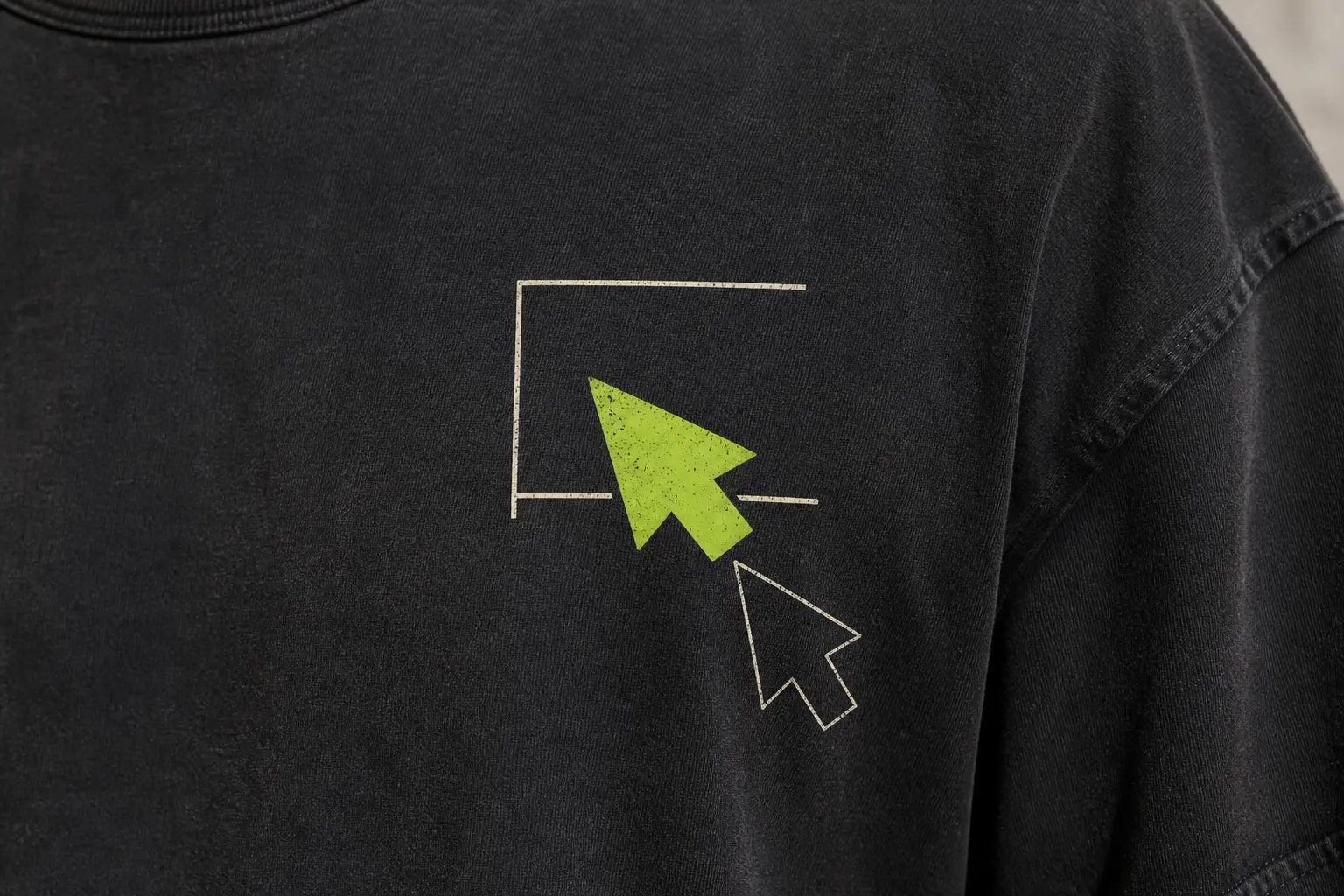 A near-black washed tee shot in extreme close-up on the chest, printed with one large bright lime arrow pointer aiming up and to the left, a hollow outline copy of the same arrow about an arrow-length below and to its right, and four thin bone lines suggesting the cropped corner of a window frame, one of which passes beneath the pointer.