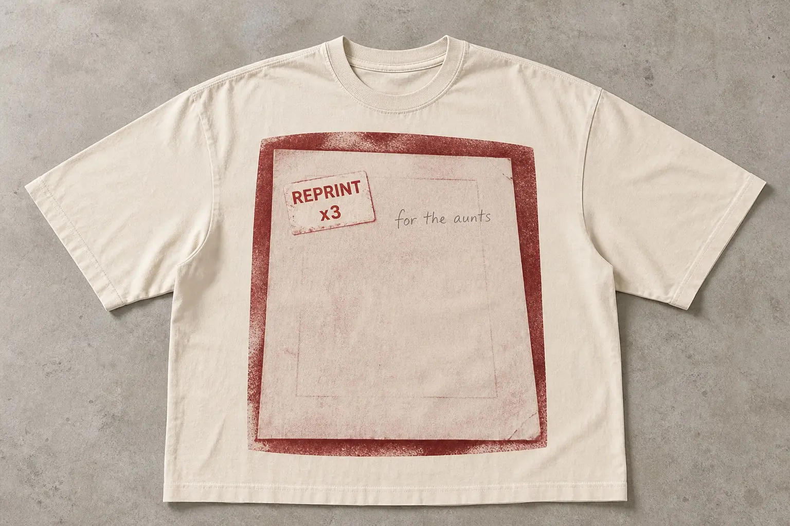 A cream t-shirt printed with the back of a single photograph shown large and plain, a small printed sticker applied slightly crooked reading REPRINT / x3, a pencilled note in a different hand beside it reading for the aunts, and a faint impression of a frame edge crossing the paper
